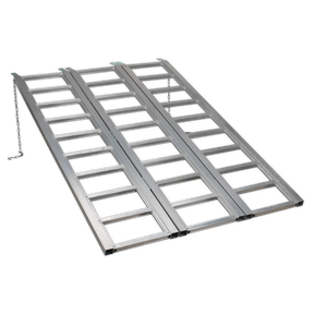 The Sealey Motorcycle/Trike/ATV & Mini Tractor Ramp Wide Tri-Fold 680kg Capacity (FLR680T) is a foldable, aluminium loading ramp designed with a grid pattern, featuring two side-by-side lanes and a safety chain on one side, perfect for loading and unloading vehicles.