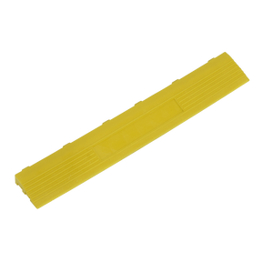 A yellow rectangular plastic object with five small raised sections on one side and horizontal grooves along its length, similar to the design seen in Sealey Polypropylene Floor Tile Edge 400 x 60mm Yellow Female - Pack of 6 model FT3EYF.