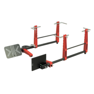 A red and black adjustable squat and bench press rack featuring safety arms, weight holders, and the Sealey Laser Wheel Alignment Gauge - GA50 for precise setup.