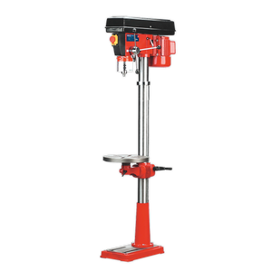 A red Sealey Pillar Drill Floor (GDM160F) features a black top, metal column, adjustable tilting table, crank handle for height adjustment, and a square base. This 16-speed floor-standing drill press is 1580mm in height with a power of 550W/230V and comes with CE certification.