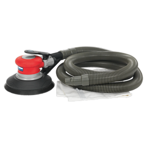 A Sealey Air Palm Random Orbital Sander Ø150mm Dust-Free Self-Contained - GSA06, in red and black, with a long, coiled hose attached, featuring a variable speed control and placed on a white cloth.