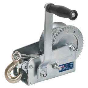 The Geared Hand Winch 900kg Capacity with Cable - GWC2000M by Sealey is equipped with a black handle, a hardened steel crank, and a single gear mechanism. It also features a durable steel cable ending in a hook.