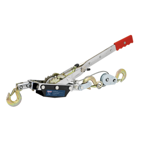 The Sealey Hand Power Puller 1500kg - HP1500 features a red handle, two hooks, and a ratcheting mechanism, making it perfect for automotive applications. This hand-operated device boasts an impressive 1500kg capacity.