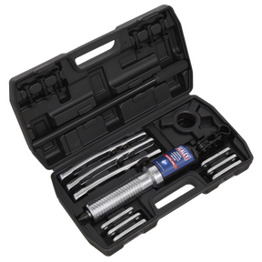 A black plastic case from Sealey contains the Triple Leg Hydraulic Puller 5 Tonne (HP5) heavy-duty puller set, complete with various metallic pullers and parts. The tools are neatly organized and securely held within specific slots in the case.