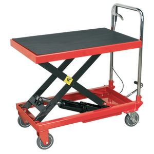 Introducing the Sealey Hydraulic Platform Truck 300kg - HPT300: This robust cart features a striking red design, complemented by a black platform, black lifting mechanism, and four wheels. Engineered for heavy-duty construction, it is equipped with a handle on one end for enhanced mobility, making it an ideal versatile mobile service bench.