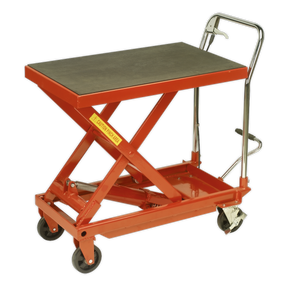 Introducing the Sealey Hydraulic Platform Truck 500kg - HPT500, a robust construction hydraulic lift table in red with a black platform, swivel wheels for easy movement, and a handle for manual maneuvering.