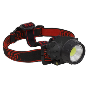 A black and red headlamp with an adjustable headband, branded "Sealey" on the band, featuring a hands-free LED spotlight that shines at 200 lumens, is known as the Head Torch 3W COB LED - HT101.