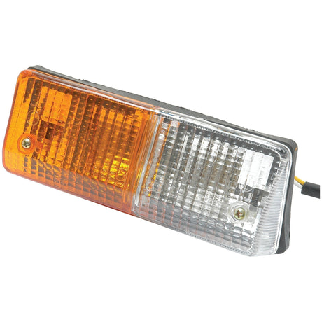 Close-up of the Halogen Front Combination Light (LH) - S.56289 by Sparex, showcasing its rectangular design with an amber lens on the left half and a clear lens on the right half. It features two screws and a connecting wire attached, ensuring bright illumination from the halogen light source inside.