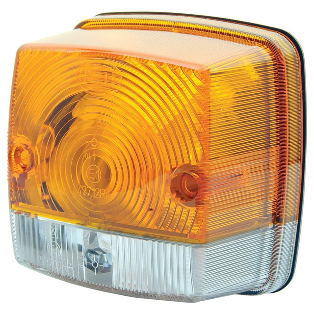 Close-up of a rectangular Sparex Front Combination Light (Halogen), 12/24V, RH & LH, Straight - S.56133 with a yellow upper section and a clear lower section, featuring a textured surface and mounting screws. The halogen light ensures high visibility, meeting IP5K9K standards.