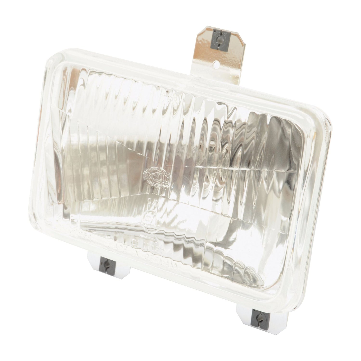 The Sparex Headlight (Halogen) RH & LH, LH Dip, 12V - S.43906 features a rectangular clear glass lens with a metal mounting bracket at the top. This IP65-rated headlight offers a textured surface and utilizes a halogen light source. It also includes two screws at the bottom for easy installation.
