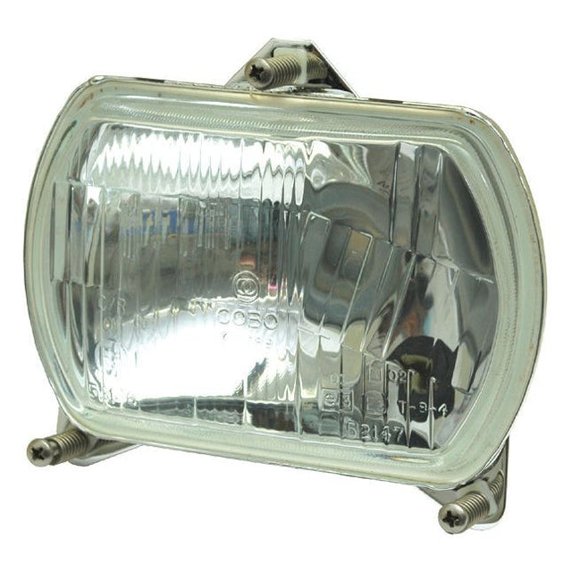 Close-up of the rectangular Sparex Head Light, model S.56388, featuring a clear lens and reflective interior. It is securely mounted with two bolts and utilizes halogen technology for bright illumination and durability, suitable for both right-hand and left-hand vehicles with LH Dip at 12V.