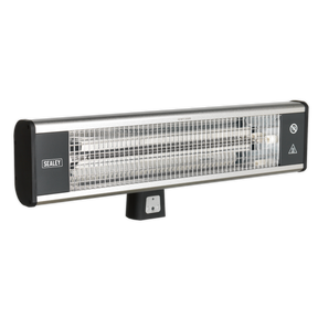 The High Efficiency Carbon Fibre Infrared Wall Heater 1800W/230V - IWMH1809R by Sealey features a metallic grill and control buttons underneath. The brand name "Sealey" is clearly visible on the left side. This IP65 rated industrial heater is designed for both indoor and outdoor use, providing durability and reliability in various environments.