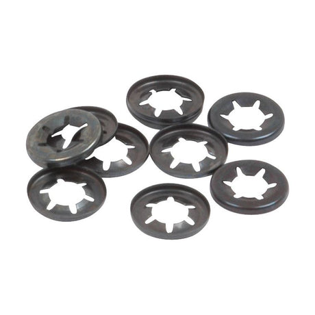 A pile of eight black Imperial Starlock Washers from Sparex NLA, each with a circular shape and radial slots, designed for a 7/32'' shaft (Sparex Part No. S.14324).