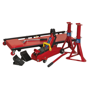 Introducing the Sealey Lifting Kit 5pc 2 Tonne - JKIT01, a comprehensive red automotive jack set that includes a Tonne trolley jack, two axle stands, two wheel chocks, and a car creeper with a padded surface and wheels.