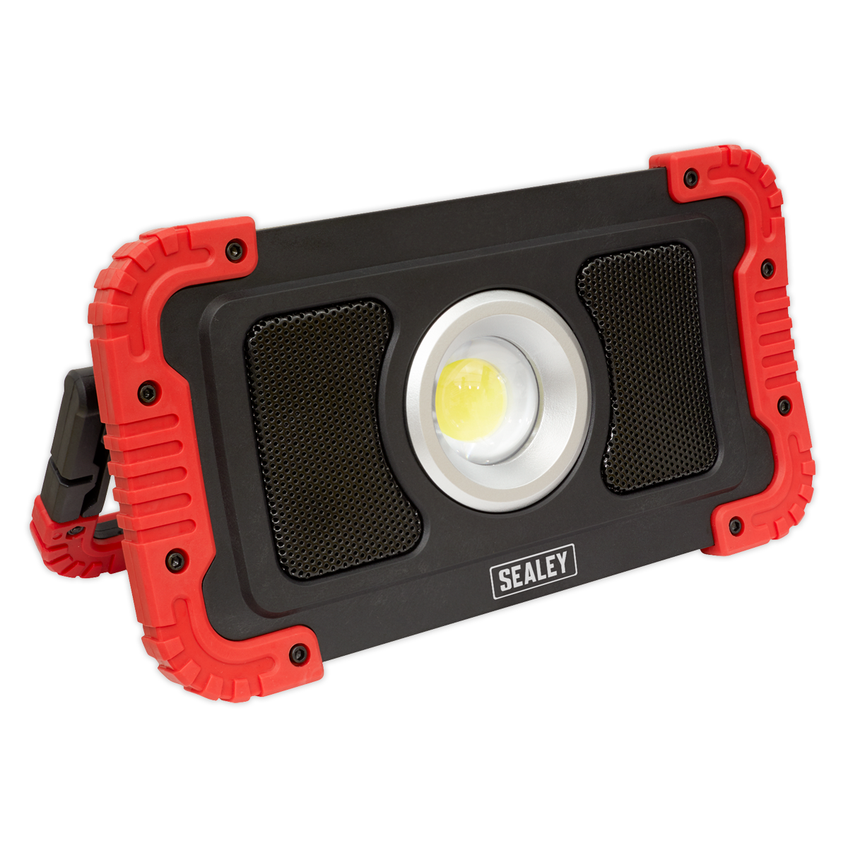 A rectangular Sealey Rechargeable Wireless Speaker Work Light, featuring a central 20W COB LED floodlight, with a black body and red protective corners.