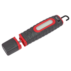 Presenting the Sealey Rechargeable 360° Inspection Light (LED3606R), a red and black handheld LED work light featuring 1000 lumens. It comes equipped with a hook for hanging, a removable cap covering the charging port, and is powered by two lithium-ion batteries. This versatile light offers 360° swivel and tilt for optimal convenience.