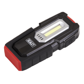 A handheld Sealey Inspection Light 3W COB & 1W SMD LED - Wireless Rechargeable - LEDWC03 in black and red, with a side power button and a magnetic base for easy attachment.
