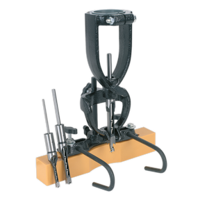 Introducing the Sealey Wood Mortising Attachment 40-65mm with Chisels - MA10, a versatile woodworking tool featuring a convenient mortising attachment on an orange block for support, and inclusive of essential chisels and bits.