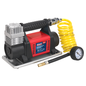 The Sealey Tyre Inflator/Mini Air Compressor 12V Heavy-Duty - MAC04 boasts a durable red and black design, complete with a coiled yellow hose and an attached pressure gauge, making it ideal for inflating car tires. It also features a quick-release coupling for effortless operation.