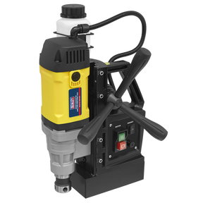 The Sealey Magnetic Drilling Machine 35mm 110V - MAG110V features a high-quality yellow and black build, complete with a control panel that has green and red buttons, two black handles for easy operation, and a coiled power cord for convenience.