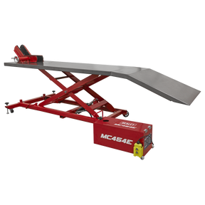 A red Sealey Motorcycle Lift 450kg - 12V Electro/Hydraulic - MC454E, featuring an extended ramp and an electro/hydraulic lifting system with a control box.