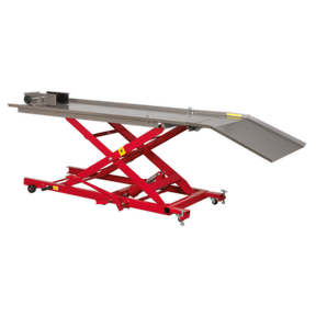 A Sealey Hydraulic Motorcycle Lift 450kg Capacity - MC454 in red, equipped with wheels and a reliable safety lock device, displayed in a fully raised position for lifting vehicles or heavy equipment.