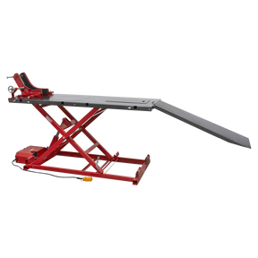 The Sealey Motorcycle Lift MC680E boasts a robust design with a 680kg capacity, featuring a red finish, an extended platform, and a sturdy ramp. It also includes a front wheel clamp to securely hold the motorcycle during maintenance tasks. The electro/hydraulic lifting system guarantees smooth elevation and comes equipped with an intuitive control unit for easy operation.