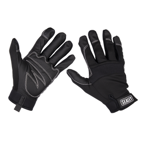 Two black touchscreen gloves with white stitching and a small 'Sealey' logo on the wrist of one glove, displayed with palms and backs visible. The anti-slip palms ensure precision control in various tasks. The product is the Mechanic's Gloves Light Palm Tactouch - Large (MG798L) by Sealey.