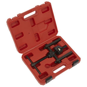 A Sealey Wheel Bearing Puller Ø12-38mm 3-Jaw (MS0621) tool with a black, corrosion-resistant finish, securely placed inside its custom-molded red plastic carrying case.