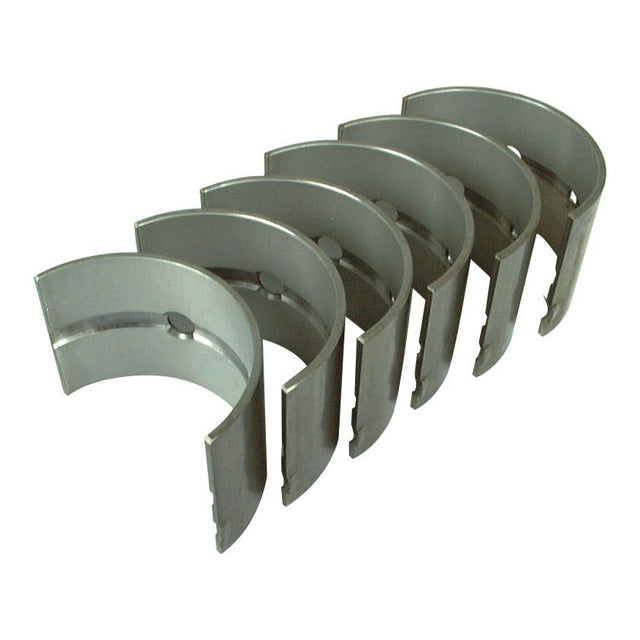 Seven semi-circular metallic objects, resembling Sparex Main Bearings +0.020'' (0.50mm) (Set) with Part Number S.57532, aligned in a row, each featuring a hole near the center and openings at both ends.