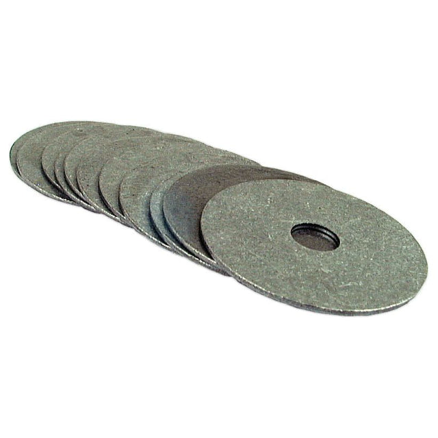 A stack of flat, round self-colour washers with central holes, arranged partially overlapping. These Sparex Metric Repair Washers, with an ID of 7mm and an OD of 33mm, conform to DIN 7973 standards (Sparex Part No. S.12392).