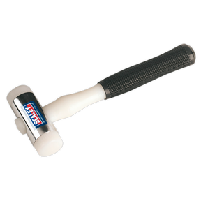 The Sealey Hammer Nylon Faced 1.25lb - NFH15 is a versatile white mallet with a black, textured handle and features the brand "Sealey" on the head. This Premier Hand Tools product boasts chrome-plated zinc heads and interchangeable nylon faces for added durability and adaptability.