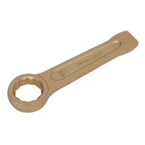 A gold-colored Slogging Spanner Ring End 30mm made from Beryllium Copper with the brand name "Sealey" engraved on the handle, shown on a white background. Ideal for professional use, this tool is part of Sealey's Non-Sparking Safety Tools line, specifically model NS031.