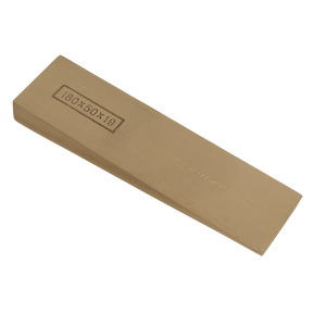 A rectangular, tan-colored sharpening stone with dimensions 180x50x19 etched on the side and labeled "Sealey Wedge 180 x 50 x 19mm - Non-Sparking - NS121," made from durable materials and backed by a lifetime guarantee.