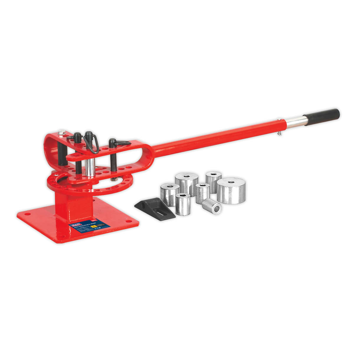 The Sealey Metal Bender Bench Mounting - PBB04, a red manual metal bender with a long handle and multiple interchangeable dies for creating radiused bends, is lying beside it on a white background.