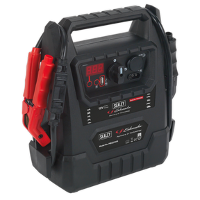 The Schumacher® RoadStart® Emergency Jump Starter 12V 2300 Peak Amps - DEKRA Approved - PBI2212GS is a portable emergency jump starter with a digital display, several control buttons, and red and black clamps. It features the "Sealey" logo and functions as a professional-grade AGM battery device that also serves as an automatic maintenance charger.