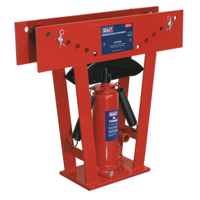 Image of a red Sealey Hydraulic Pipe Bender (model PBS99/14) with a label indicating a capacity of 16 tonnes. The bender features heavy-duty 16-tonne hydraulics, a bottle jack, two springs, and a reinforced steel frame.