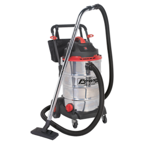 The Sealey Vacuum Cleaner Wet & Dry 60L Stainless Drum 1600W/230V - PC460 features an industrial-grade stainless steel drum and includes a black EVA crush-resistant hose and nozzle attachment, all mounted on wheels for easy portability.