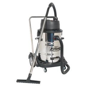 The Sealey Vacuum Cleaner Industrial Wet & Dry 77L Stainless Steel Drum with Swivel Emptying 2400W - PC477 is a high-performance unit boasting superior vacuuming power. It features a durable stainless steel body, a black plastic top, and a black hose attachment. The vacuum cleaner also comes equipped with a wheeled base for easy mobility.