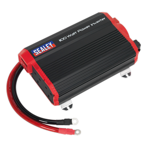 A black and red Sealey power inverter, model PI1100, providing 1100 Watts of modified sine wave power at 12V DC to 230V ~ 50Hz, complete with attached cables and USB charging ports.