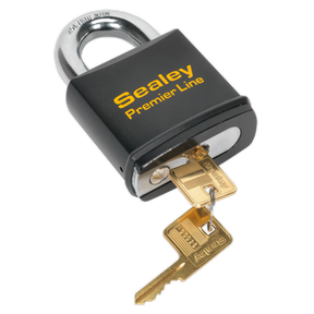 A black Sealey Steel Body Padlock 70mm - PL504 with "Premier Line" text engraved, featuring a heavy-duty steel construction and an anti-drill, 6-pin brass cylinder. It is shown with two gold-colored keys inserted in the lock.