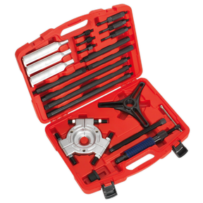 A red tool case from Sealey, the Hydraulic Bearing Separator/Puller - PS9821, featuring an assortment of black and silver steel tools such as a gear puller set, chisels, and other hand tools arranged in designated slots.