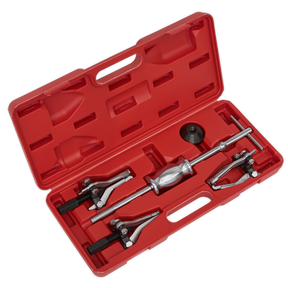 The Sealey Slide Hammer Gear/Bearing Puller Set 5pc - PS992 comes in a red plastic case and includes various attachments, such as triple leg pullers, suitable for automotive or mechanical use.
