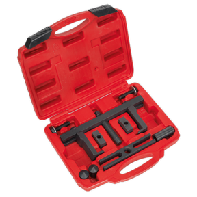 The Sealey Crankshaft Pulley Removal Tool Set 12pc - PS997 is a red plastic carrying case containing a variety of specialized black metal components for crankshaft pulleys removal.