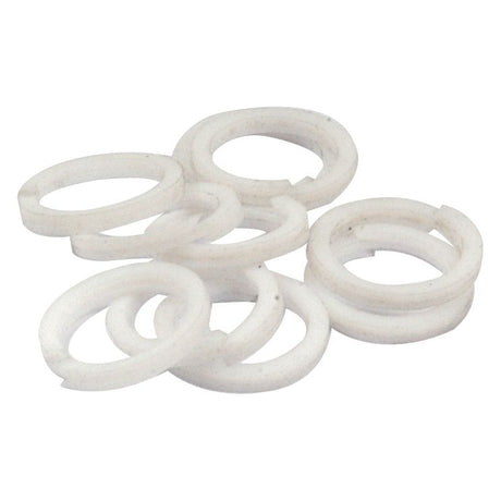 A pile of PTFE Back-Up Ring Bs012 Spirals (Sparex Part No. S.40877) is shown against a plain white background, perfect for your Massey Ferguson machinery and available at Sparex.
