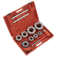 A red plastic toolbox featuring Sealey's Pipe Threading Set 7pc 3/8"-2"BSPT - PTK992, complete with metal circular dies, tap handles, and various neatly arranged tools—a perfect ratchet-type pipe threading kit.