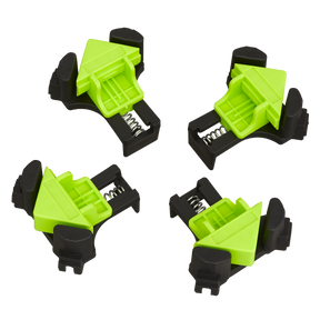 Four Sealey Mitre Wood Corner Clamps from the QBC04 set, ideal for fixing frames at a precise 90° angle, are arranged against a white background.