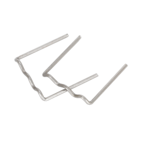 Two metal staples, possibly Sealey U-Staple 0.8mm Pack of 100 - RE08, bent out of their original shape, lie on a plain surface.