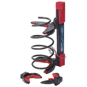 The Coil Spring Compressor Kit 1600kg - RE225 by Sealey is a red and black tool equipped with safety yokes, two sets of clamps, and a screw mechanism for compressing springs, typically used in automotive suspension repairs.