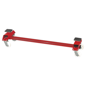 The Sealey Transportacar Trolley Economy Model RE89, with a 2-tonne capacity, is a red metal dolly designed with a sturdy steel frame. It features two swiveling nylon castors and two fixed castors, making it perfect for moving heavy objects in the workshop.